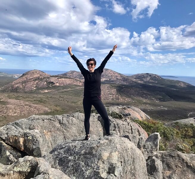 Woman on top of Frenchman Peak, Cape Le Grande WA