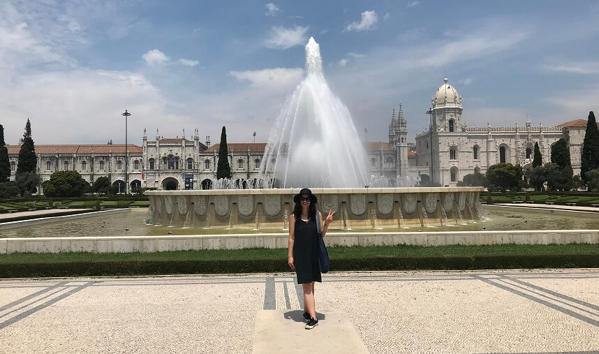 Woman in front of a fountain in Lisbon