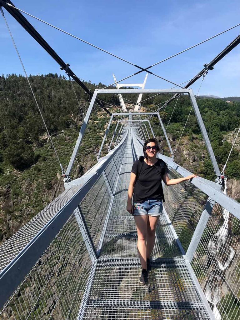 Woman looks at the camera as she crosses Ponte 516